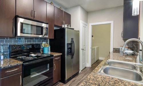 a kitchen with black appliances