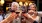 a group of people holding wine glasses