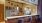 a kitchen with a bar and chairs