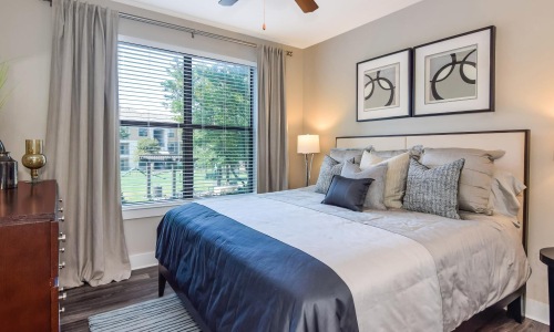 a bedroom with a large window